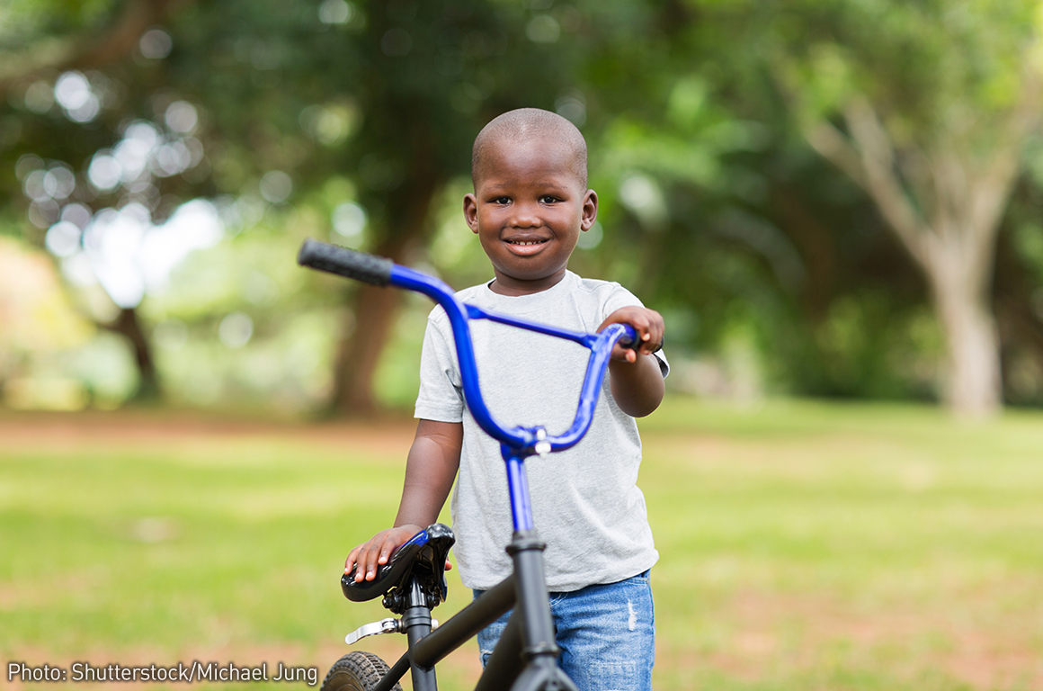 little kid riding bike
