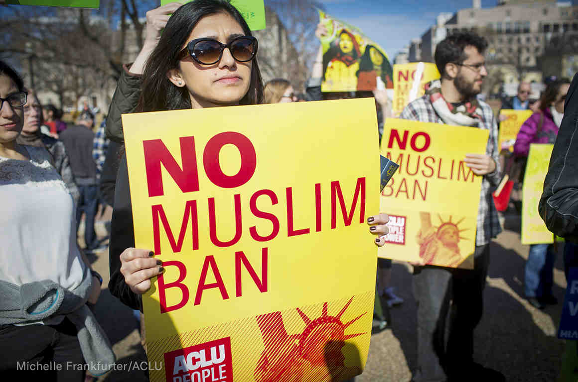"No Muslim Ban" signs at a rally