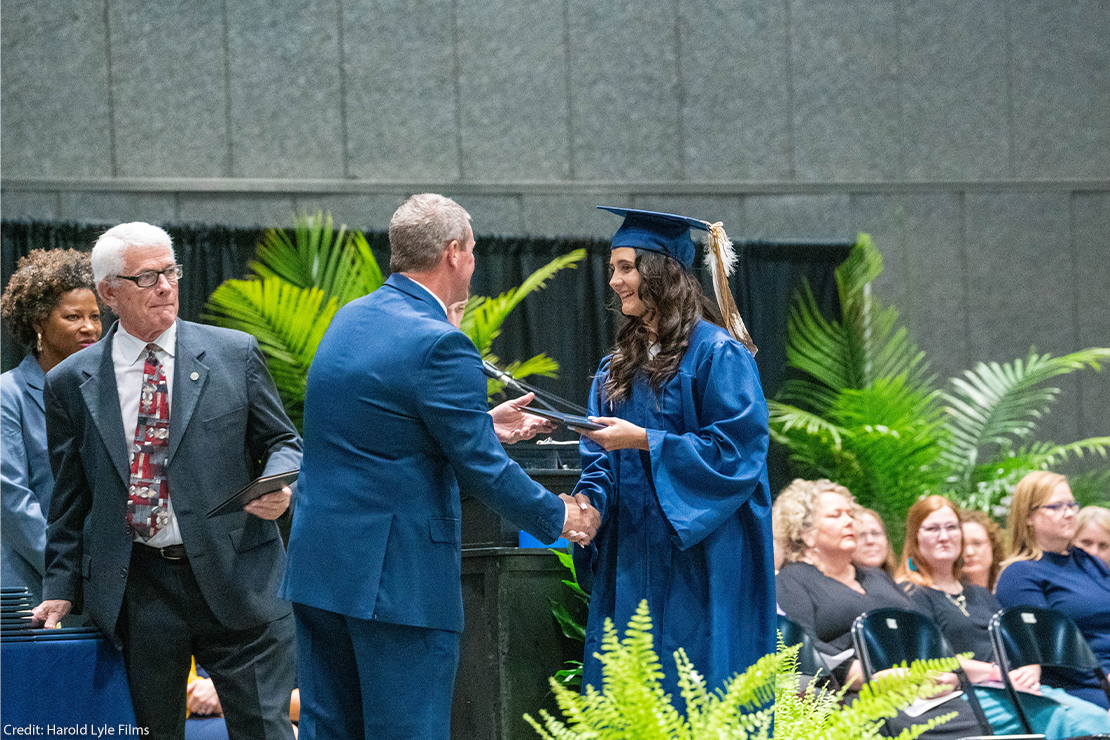 A photo of Indigenous student Zuri graduating.